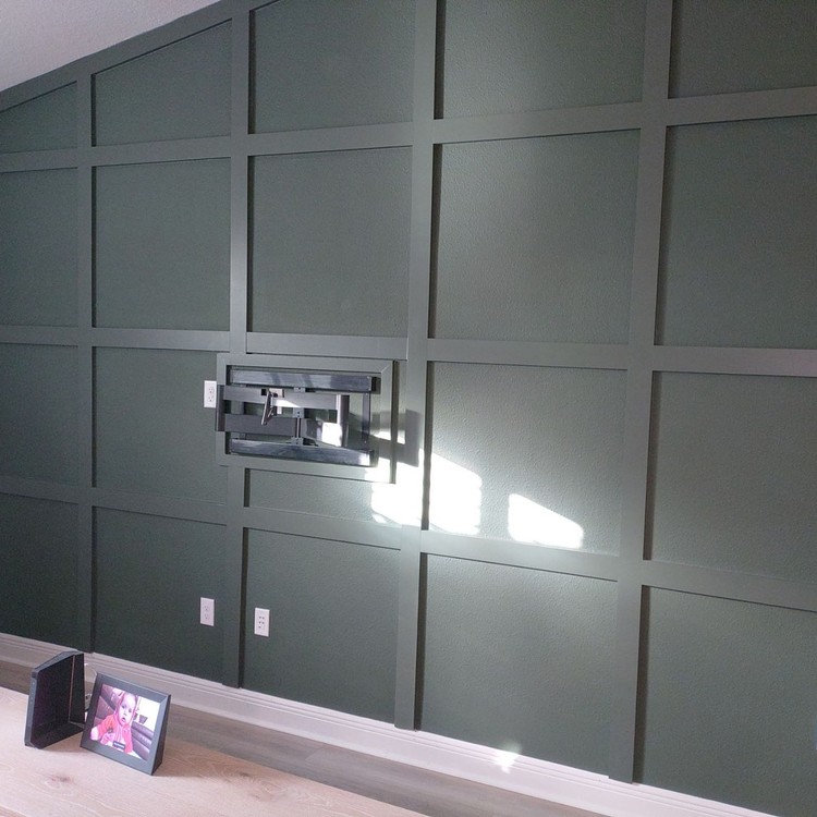 Dark green board and batten feature wall