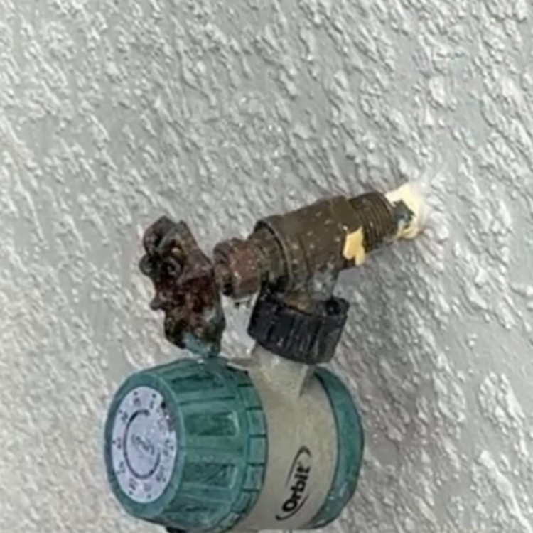 Leaking outdoor hose bib before repair