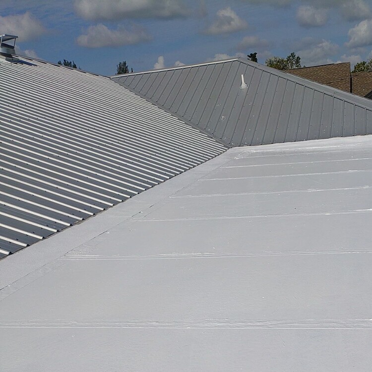Metal pan roof sealed with a white roof coating